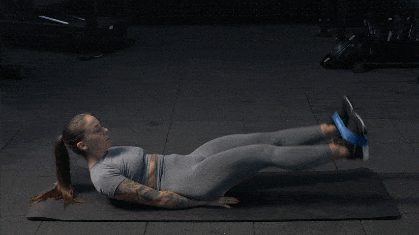 Упражнение Повдигане на крака с ластик от лег (Banded Lying Leg Raises)